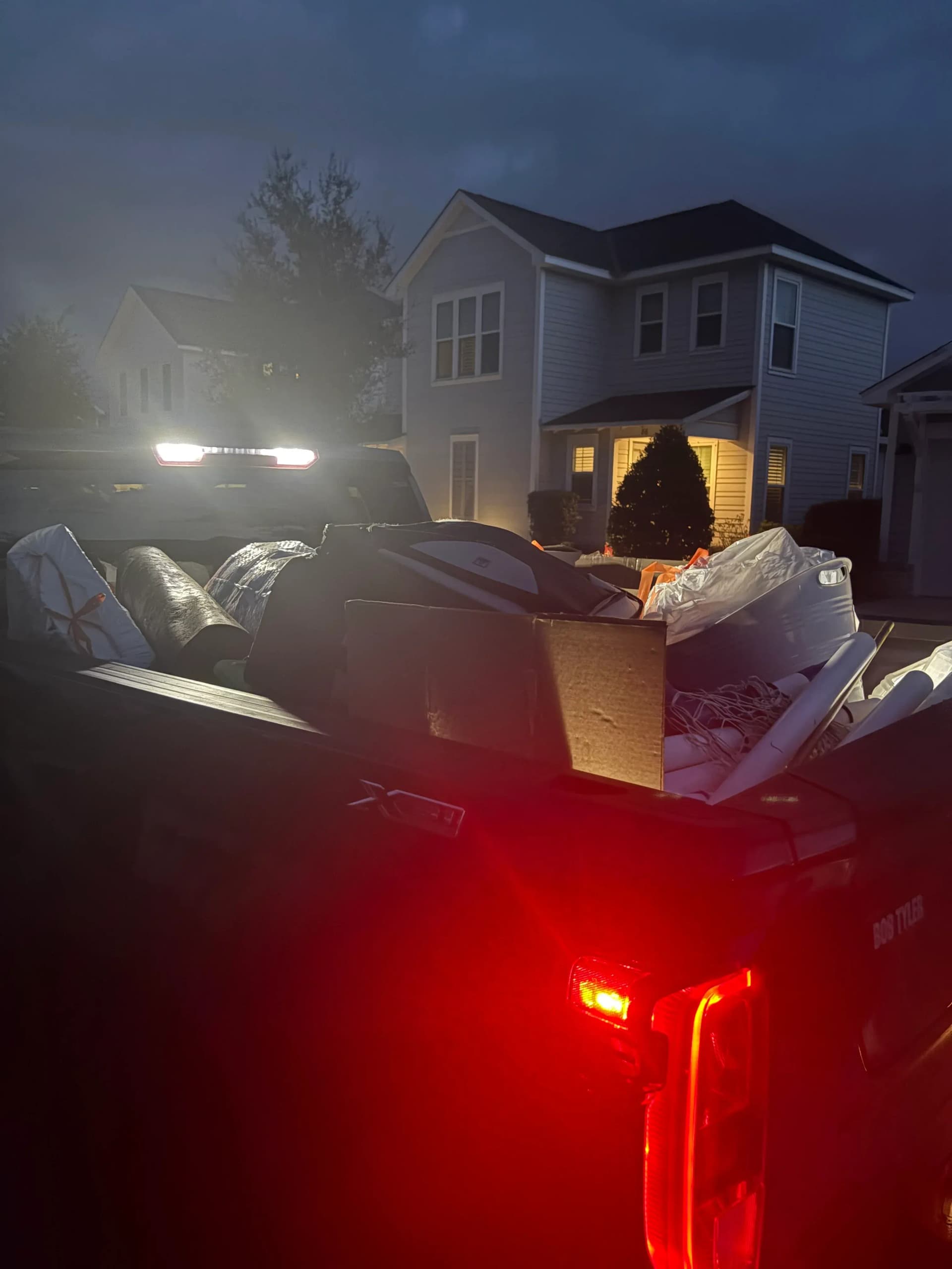 30A Junk Removal truck loaded with furniture and junk ready for quick haul